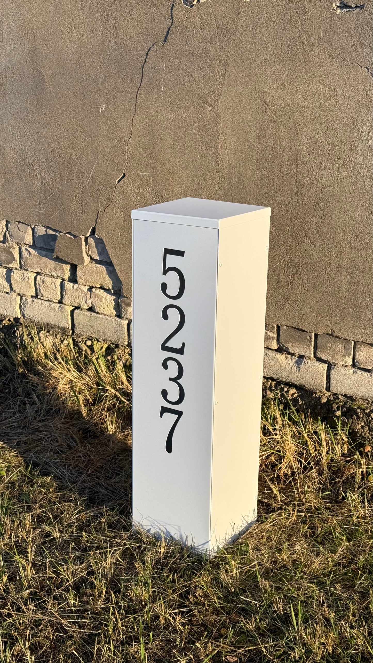 Side view on the ground of Modern Freestanding Steel Address Column & House Number Sign in white