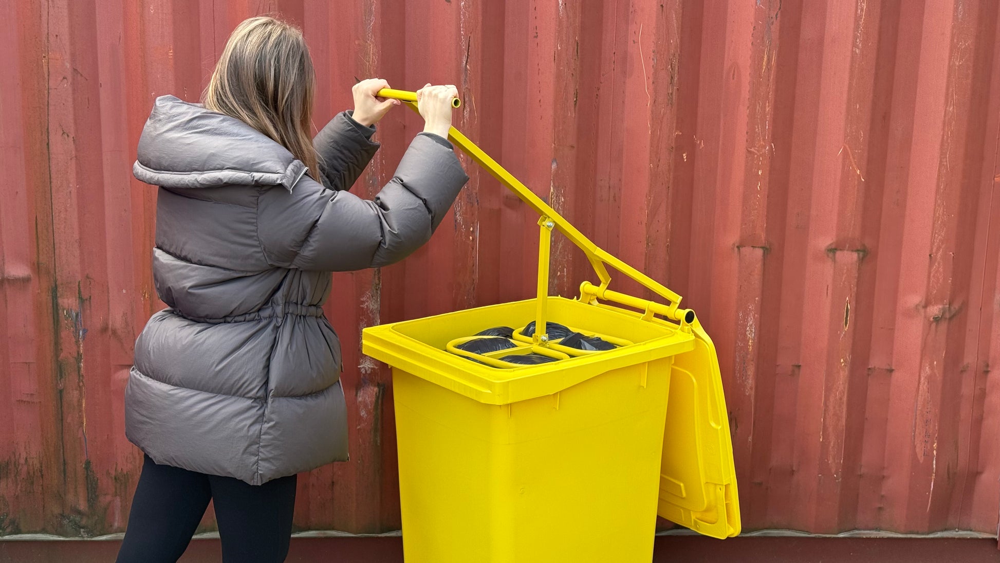 Front view in use with Manual Metal Trash Compactor - PRESS