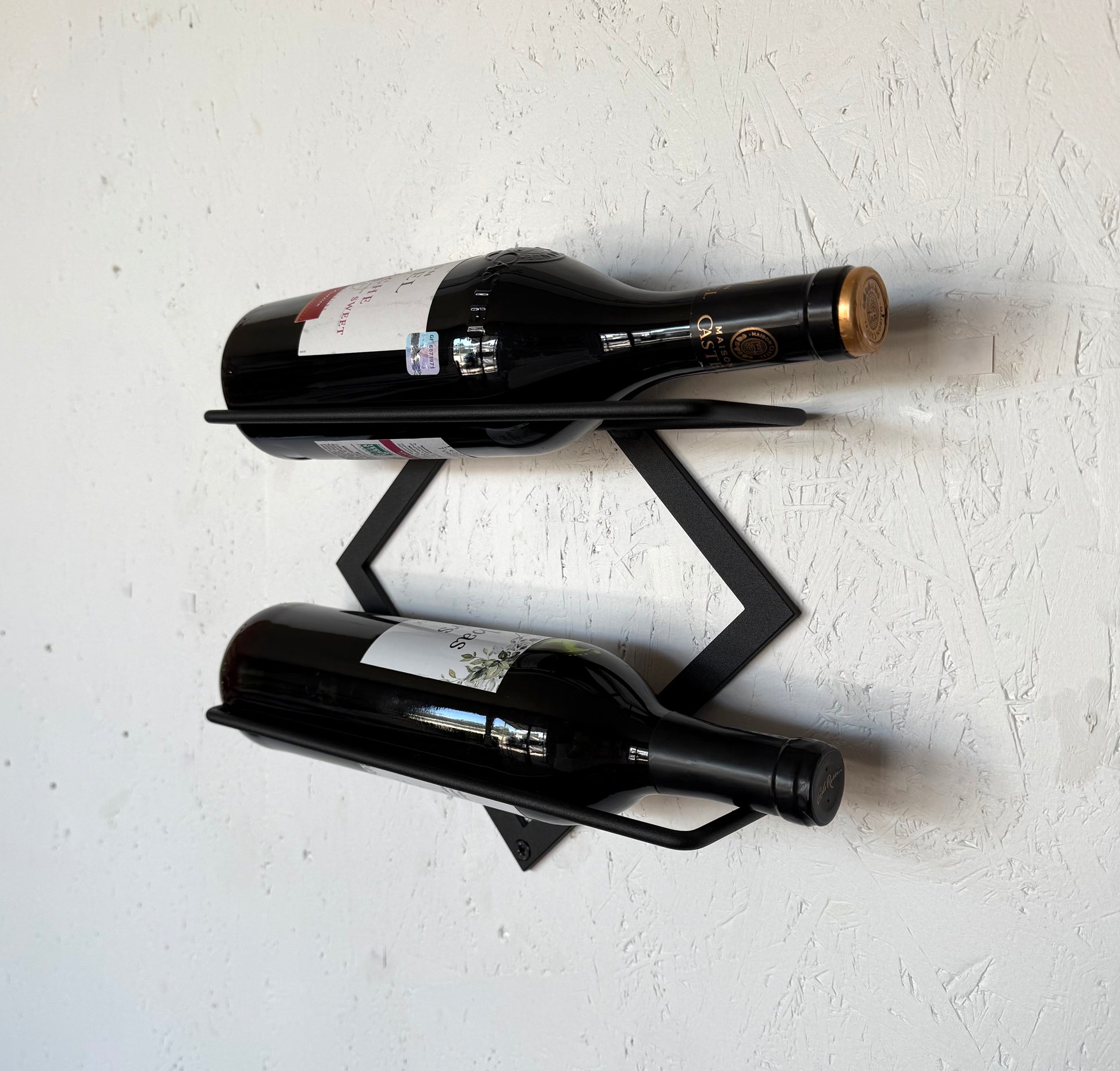 Front view with wine bottles of wall-mounted metal wine bar shelf