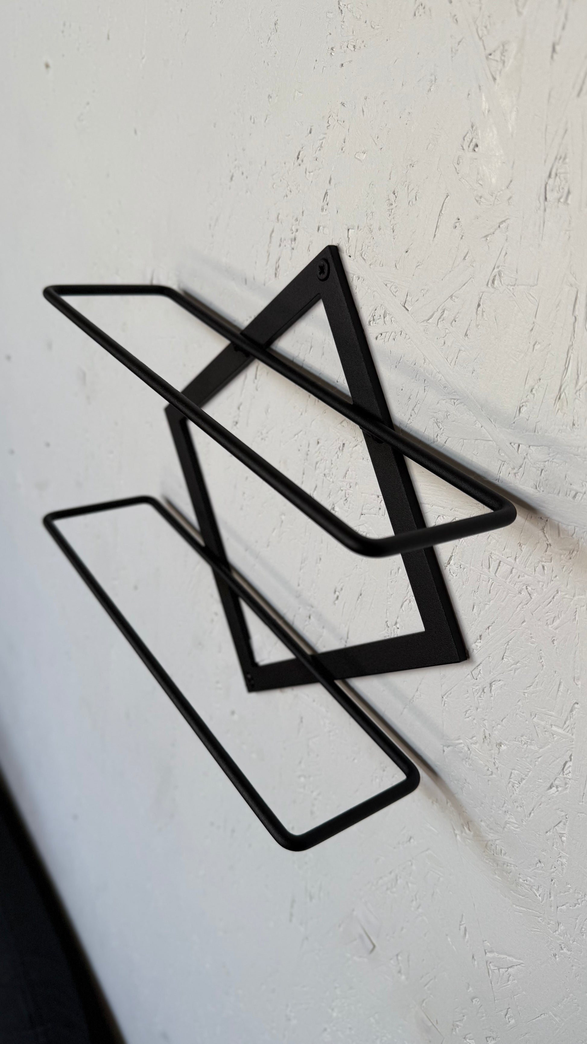 Side view of wall-mounted metal wine bar shelf