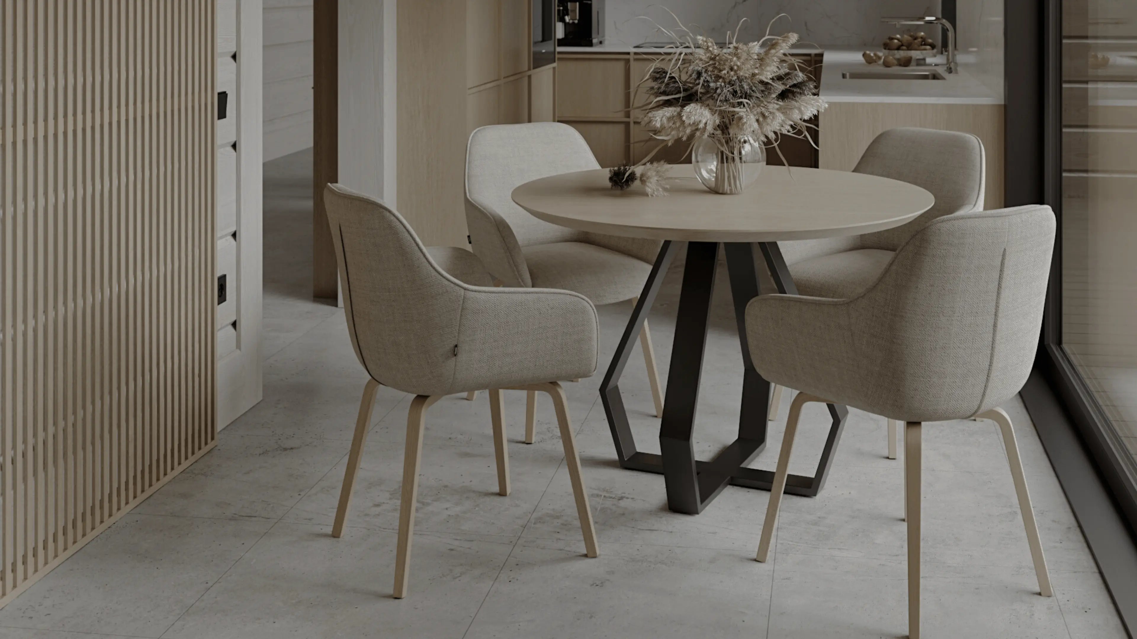 Dining area with a round table and four chairs in a modern kitchen.