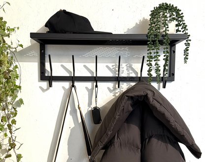 Front view in interior of Steel coat & hat rack with shelf