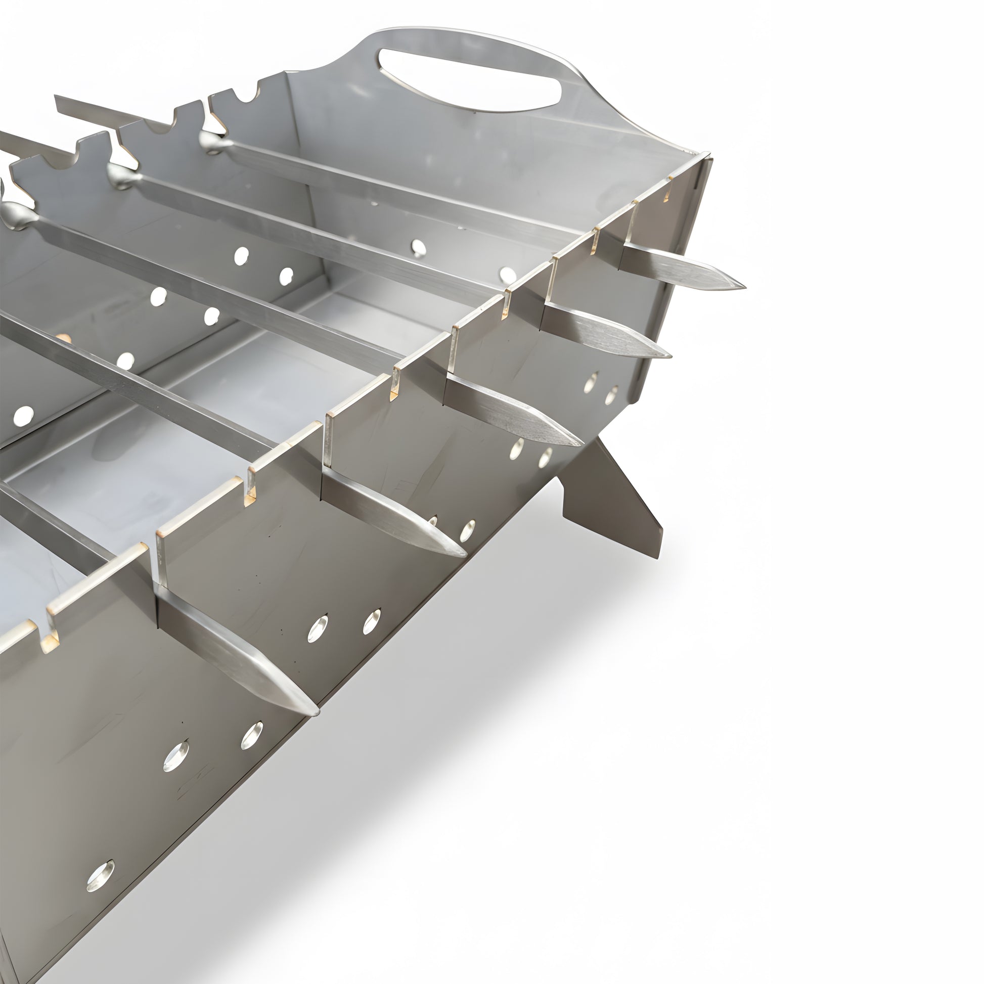 Close-up of stainless steel skewer grill notches evenly spaced for shashlik and kebab cooking above hot charcoal