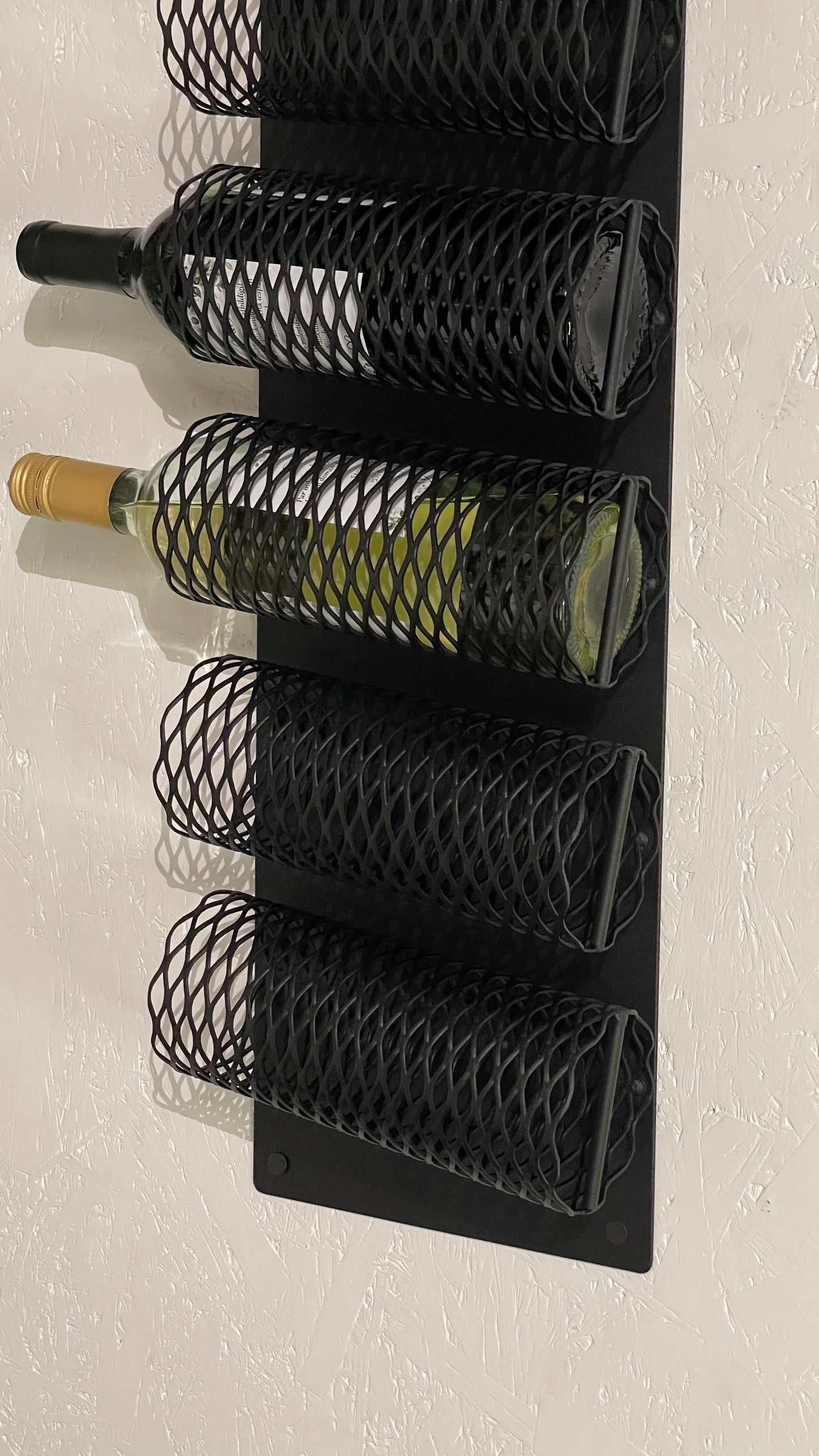 Close-up with wine bottles of Wall-Mounted Metal Wine Rack