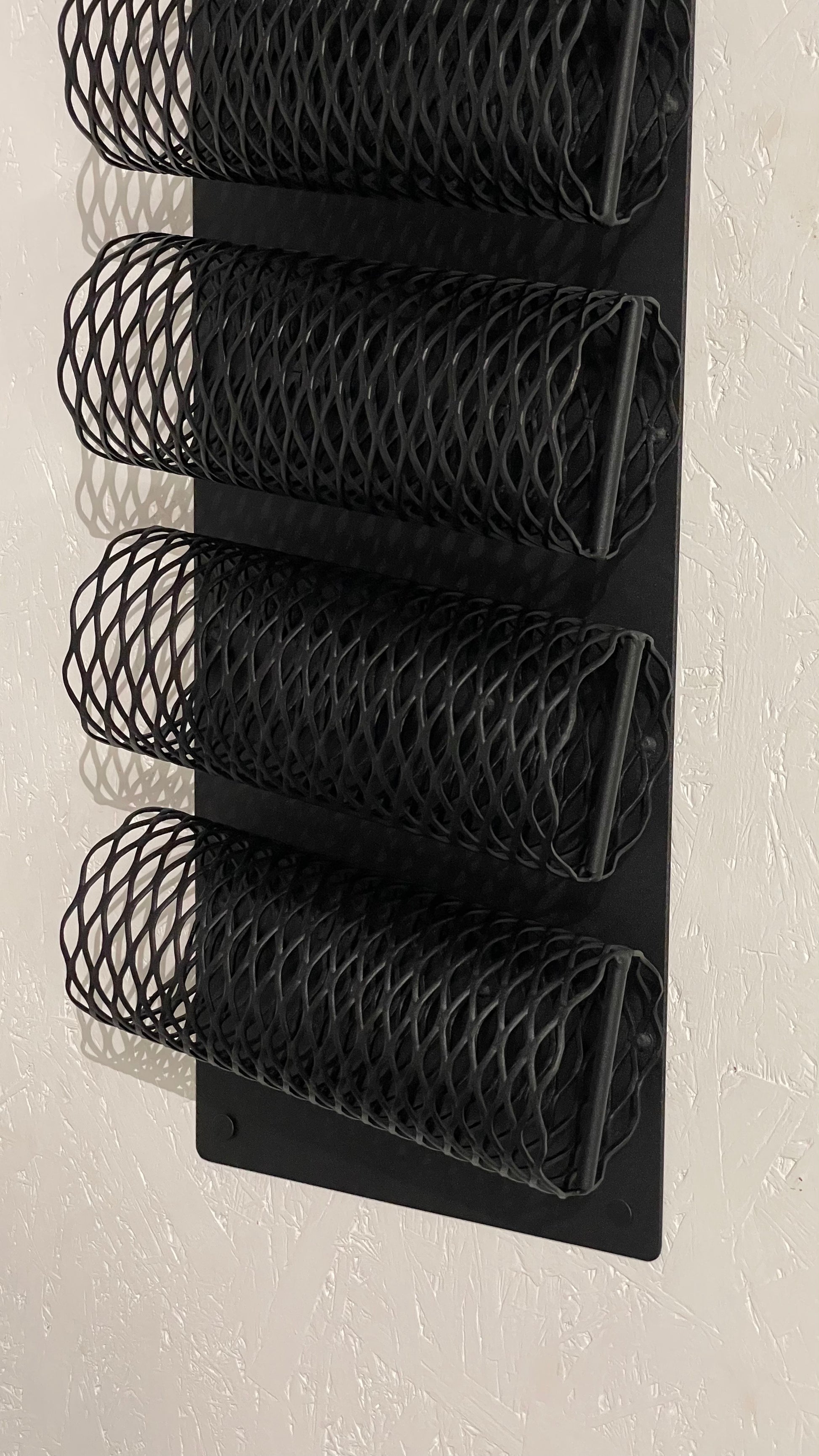 Close-up with bottom part of Wall-Mounted Metal Wine Rack