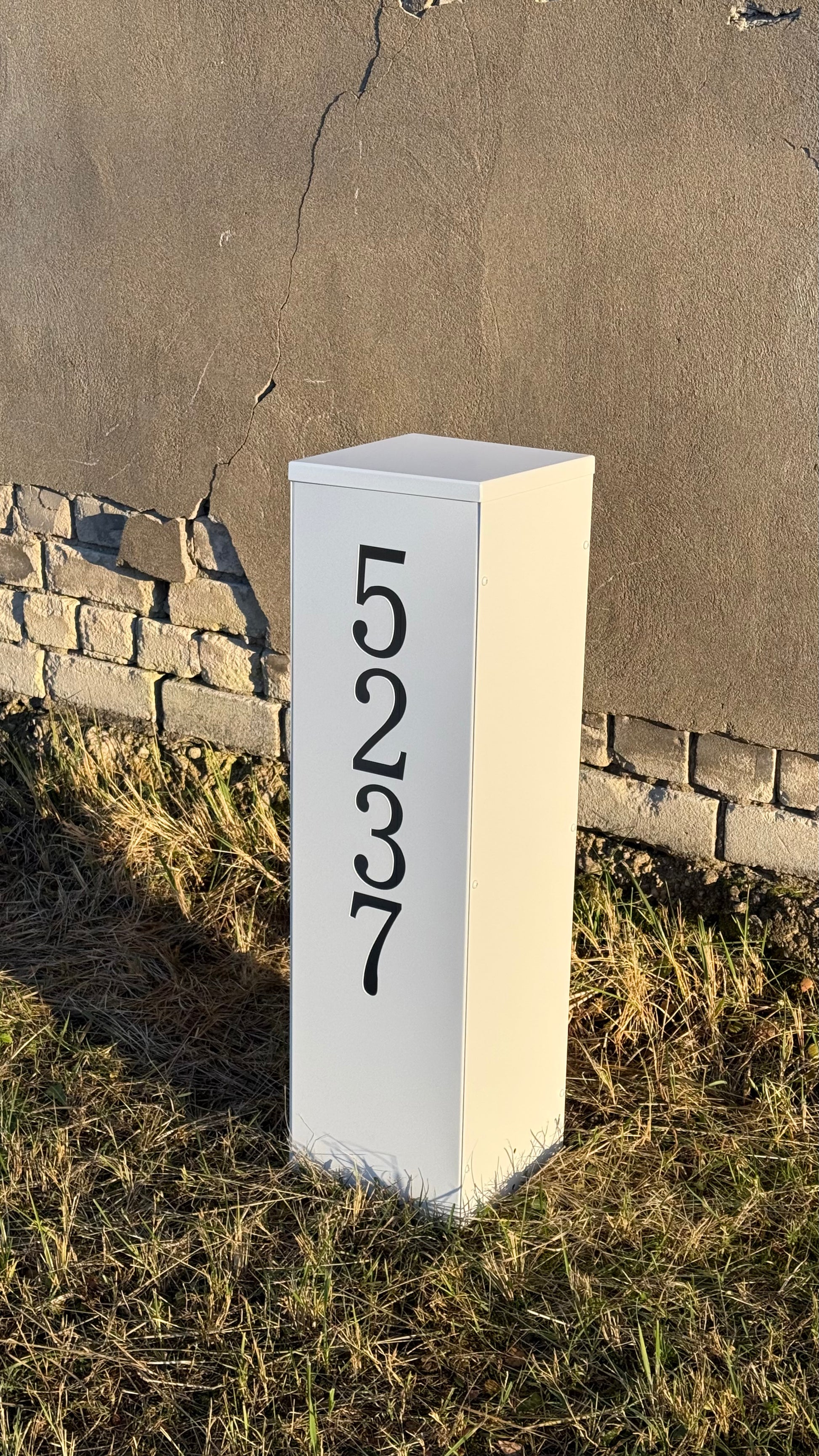 Side view on the ground of Modern Freestanding Steel Address Column & House Number Sign in white