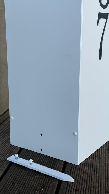 Close-up with bottom part of Modern Freestanding Steel Address Column & House Number Sign in white