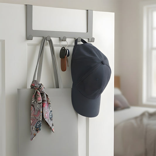 Modern over-the-door hook rack with 5 hooks mounted on a white bedroom doo
